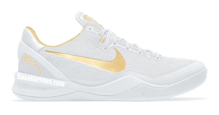 Side view of Kobe Bryant's white and gold Nike shoe.